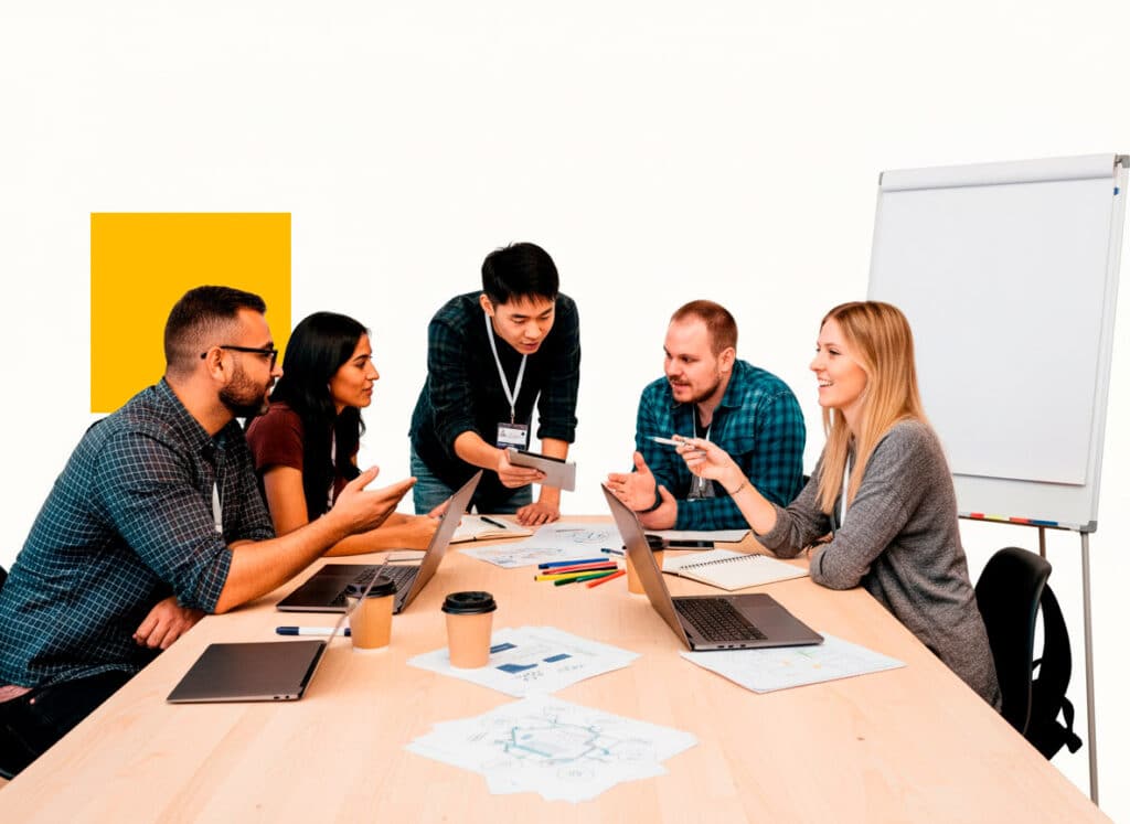 A bright, high-key photograph of a diverse team of five professionals collaborating around a light wood conference table, illustrating a high-performing augmented staff integrated into a project team.