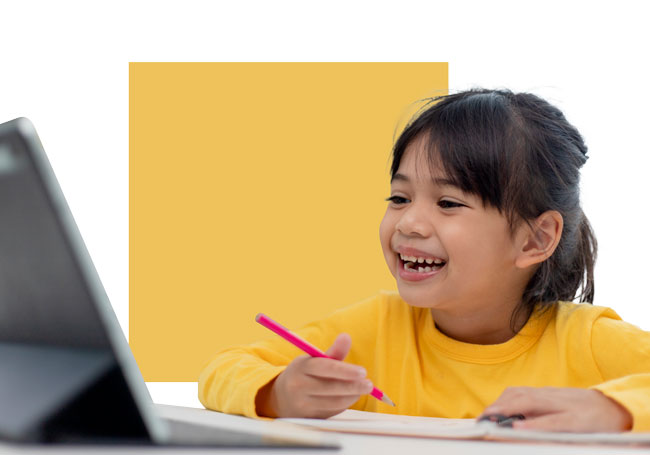 little girl smiling while use a tablet and write on her notebooks